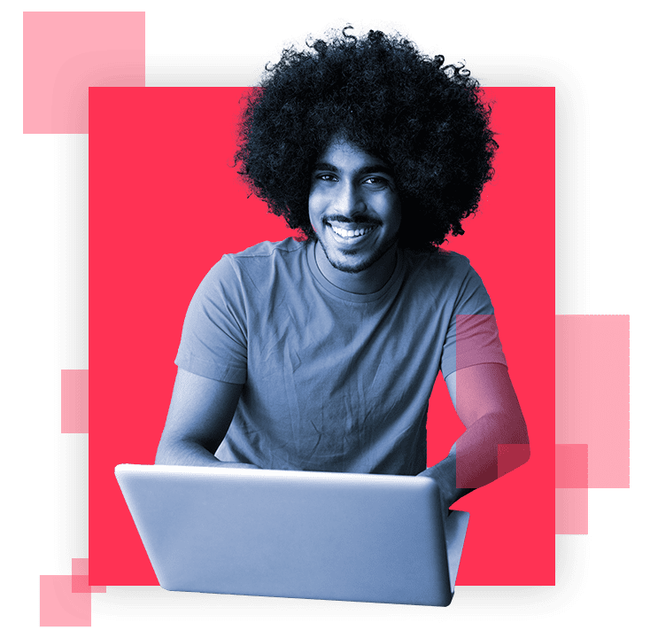 Man smiling with laptop in front
